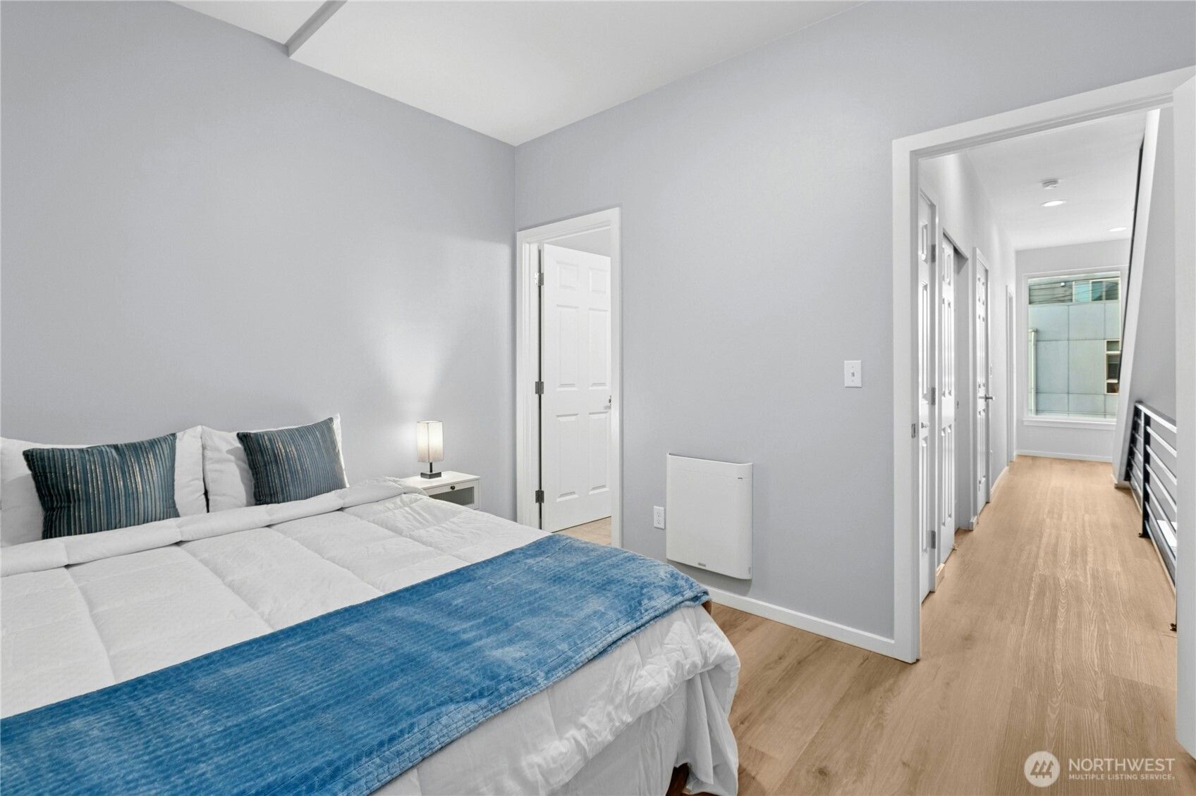 6641 Carleton Avenue South, Unit B Seattle, WA 98108 - Photo 16 of 33 a bedroom with a bed and wooden floor