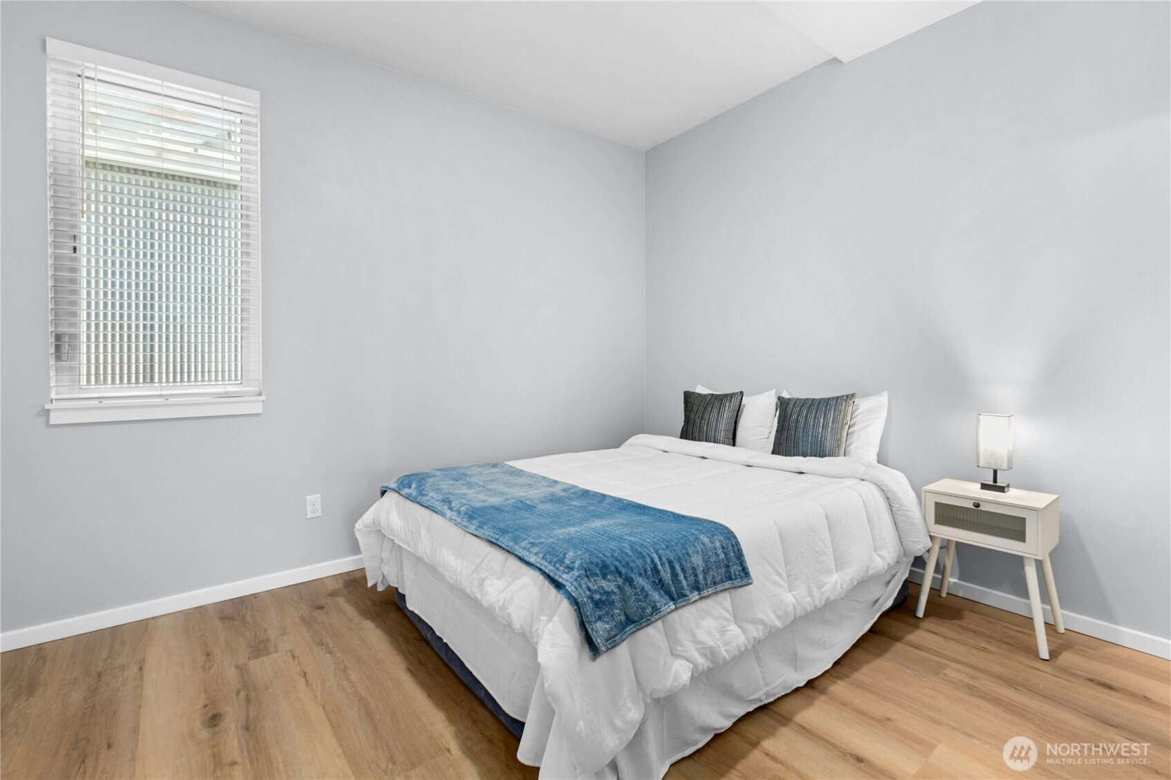 6641 Carleton Avenue South, Unit B Seattle, WA 98108 - Photo 17 of 33 a bedroom with a bed and a window