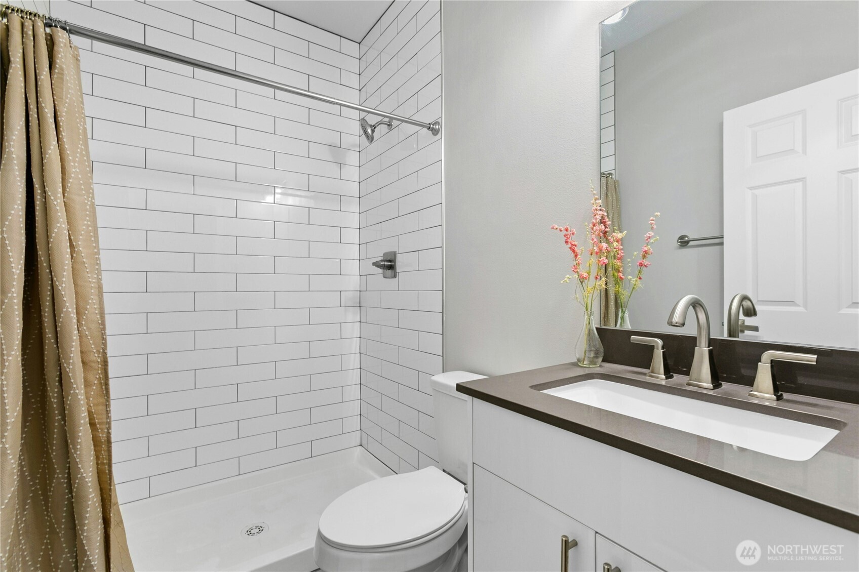 6641 Carleton Avenue South, Unit B Seattle, WA 98108 - Photo 18 of 33 a bathroom with a sink a toilet and shower