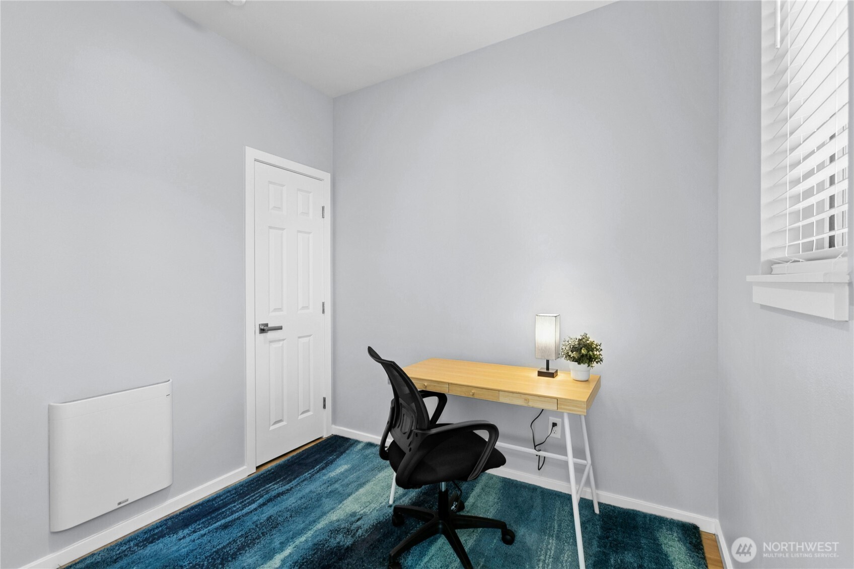 6641 Carleton Avenue South, Unit B Seattle, WA 98108 - Photo 19 of 33 a view of a workspace with furniture and wooden floor