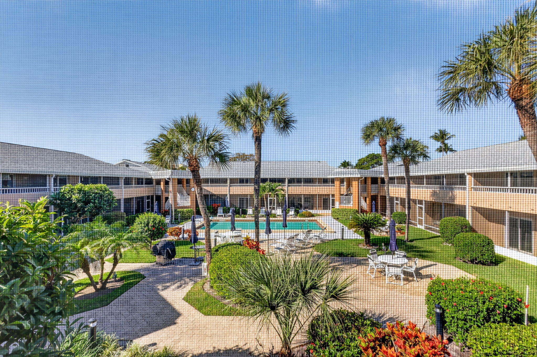 1100 Surf Road, Unit 201 Singer Island, FL 33404 - Photo 17 of 63 Beautiful Pool View from Screened Patio