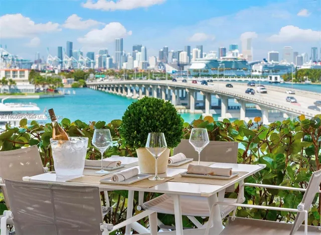 a view of city from terrace with seating space