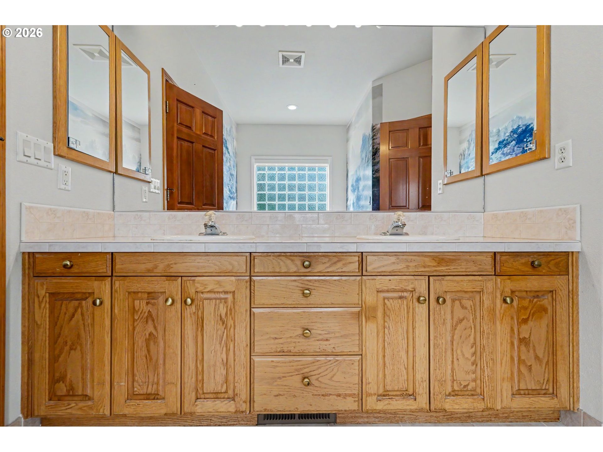 1470 Ranier Loop Northwest Salem, OR 97304 - Photo 34 of 48 a bathroom with a sink a mirror and a shower
