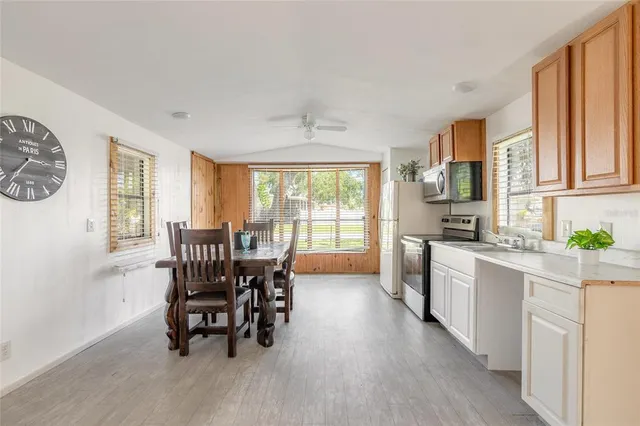 a view of a dining room with furniture window and outside view