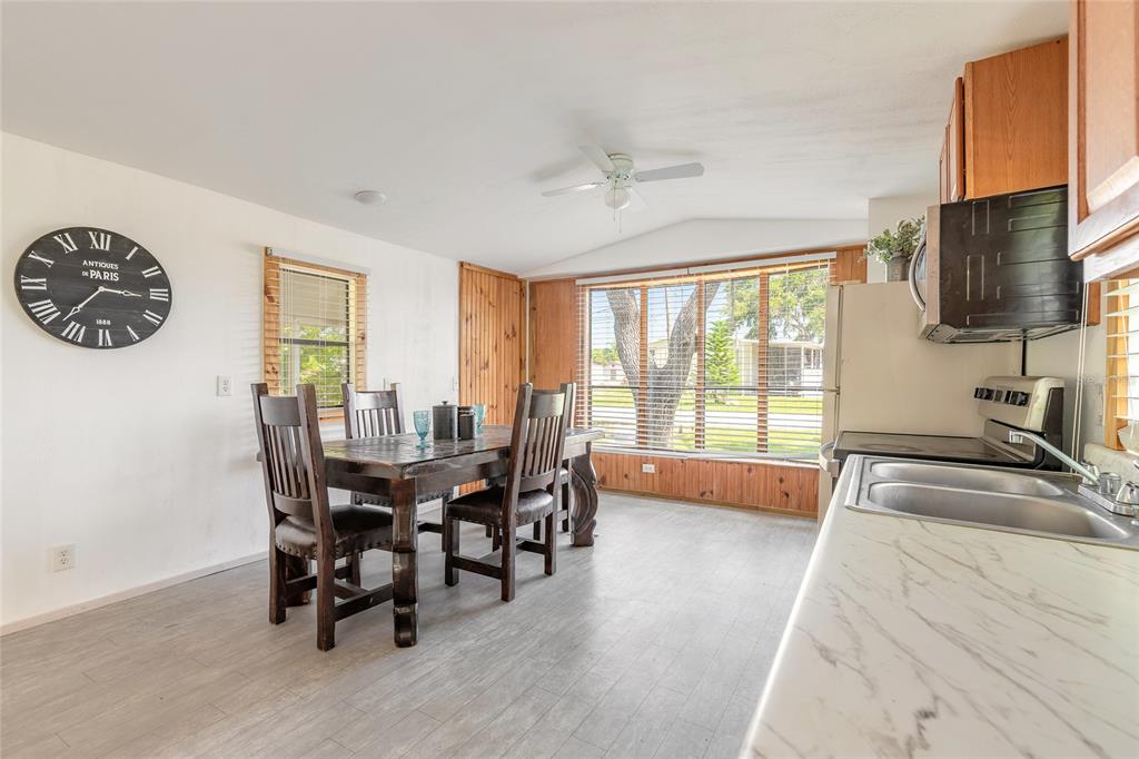 182 Douglas Street Edgewater, FL 32141 - Photo 12 of 30 a view of a dining room with furniture window and outside view