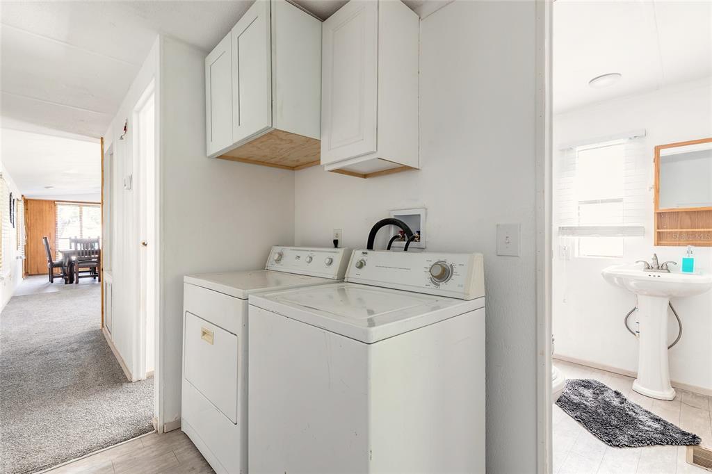 182 Douglas Street Edgewater, FL 32141 - Photo 17 of 30 a utility room with dryer and washer