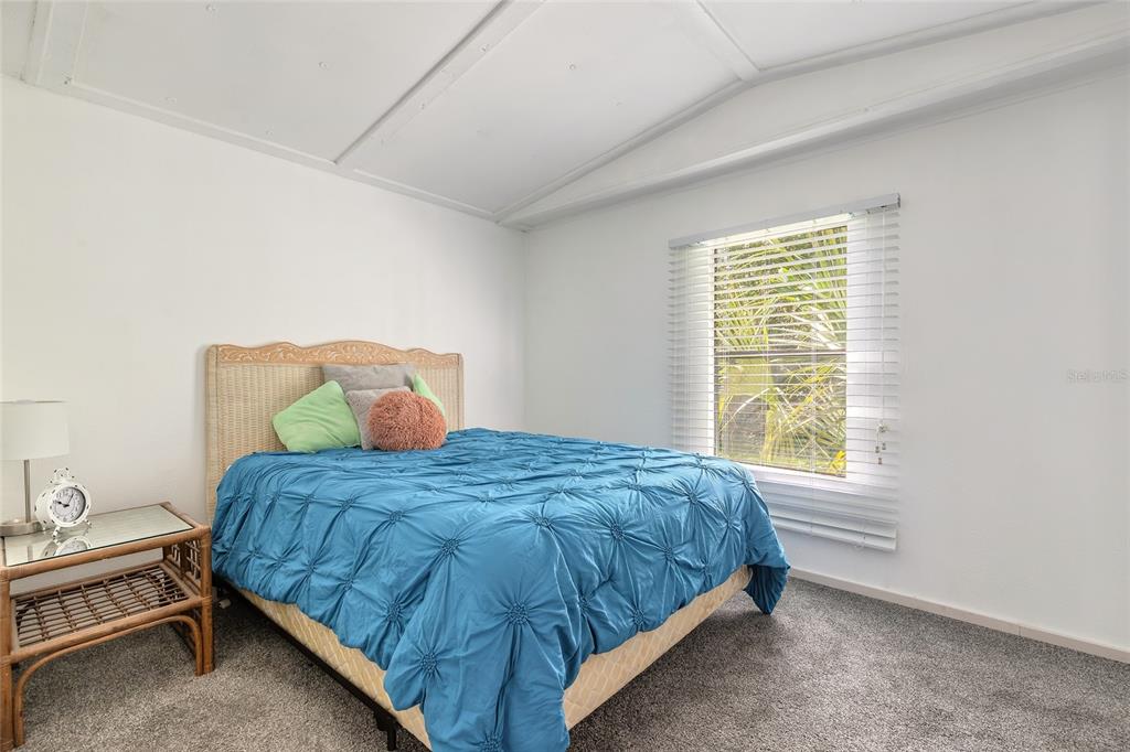 182 Douglas Street Edgewater, FL 32141 - Photo 18 of 30 a bedroom with a bed and window