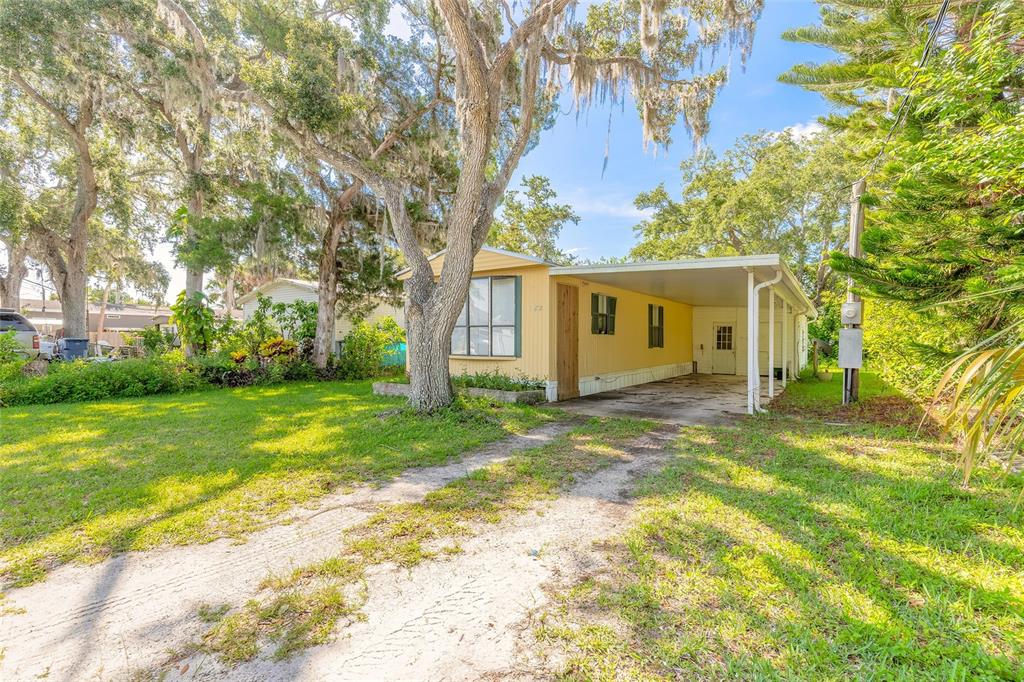 182 Douglas Street Edgewater, FL 32141 - Photo 2 of 30 a view of a house with backyard and garden