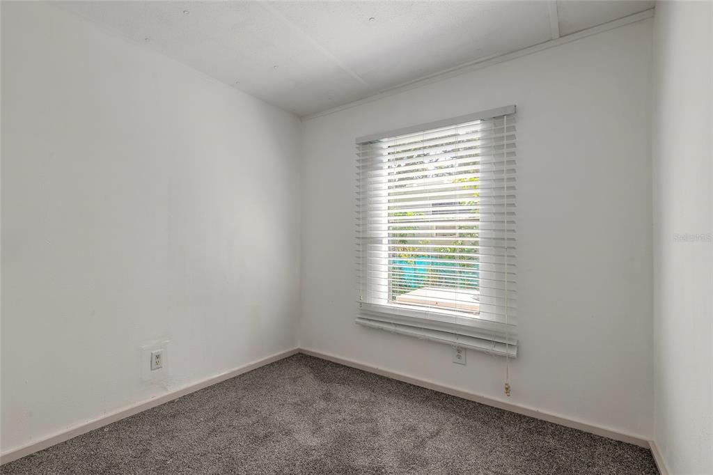 182 Douglas Street Edgewater, FL 32141 - Photo 21 of 30 an empty room with a window