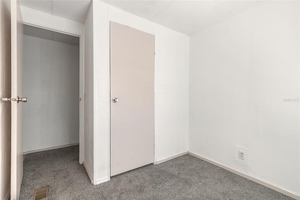 182 Douglas Street Edgewater, FL 32141 - Photo 22 of 30 an empty room with closet