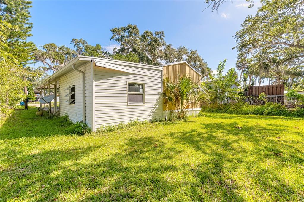 182 Douglas Street Edgewater, FL 32141 - Photo 24 of 30 a view of a house with a yard