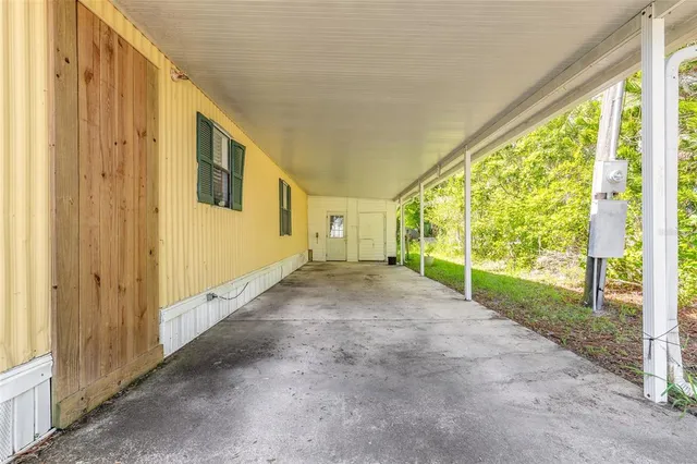 a view of a house with backyard and porch