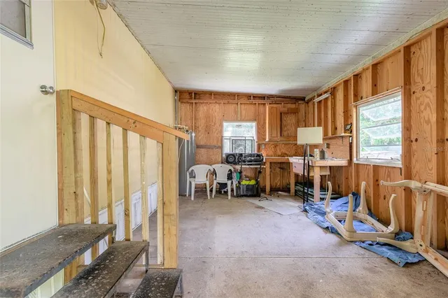 a view of a livingroom with furniture and a window
