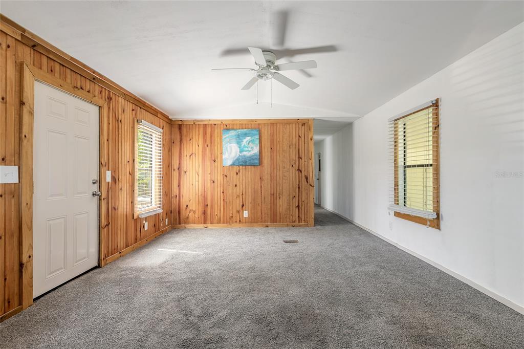 182 Douglas Street Edgewater, FL 32141 - Photo 8 of 30 a view of an empty room with a window