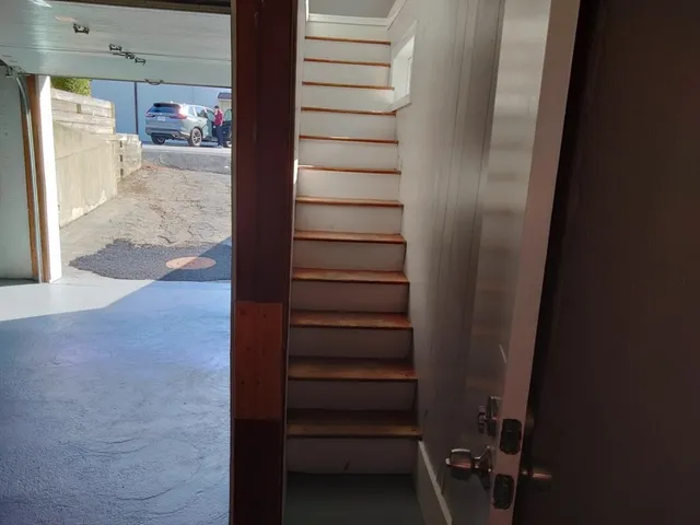 a view of a room with wooden walls