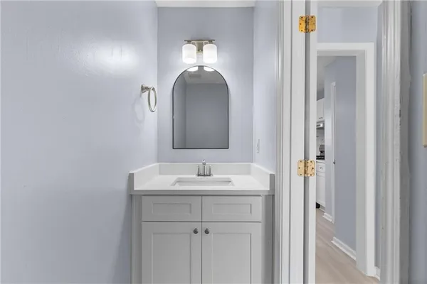 a bathroom with a sink and a mirror