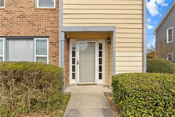 a front view of a house with a garden