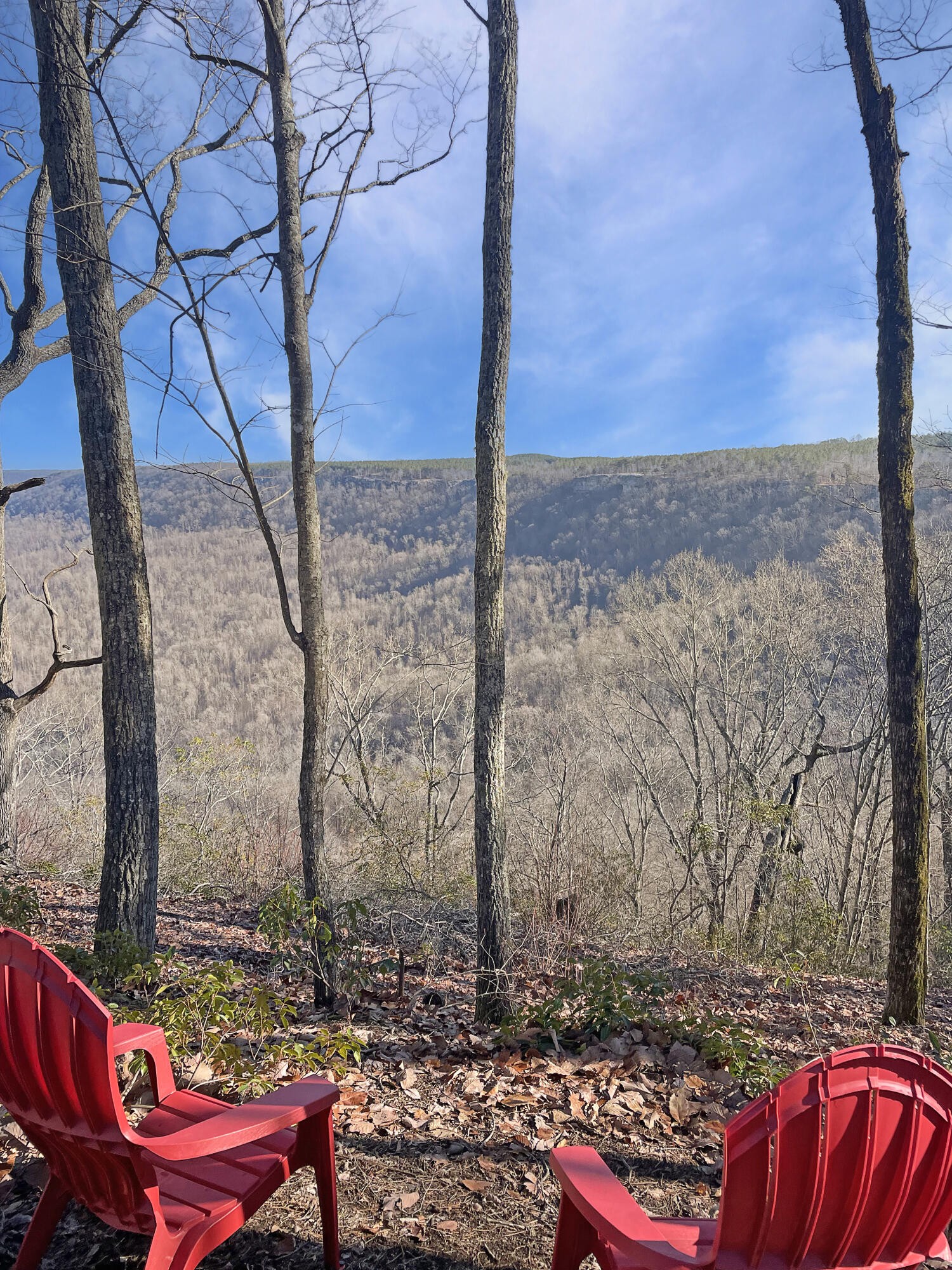 a view of a red chair with a fire pit