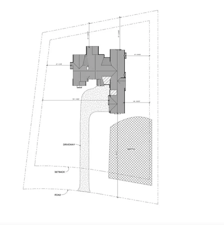 a view of a backyard with wooden fence