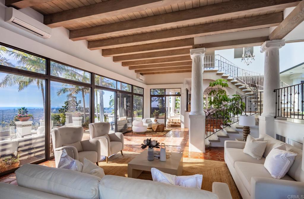 7157 Obelisco Circle Carlsbad, CA 92009 - Photo 17 of 44 a view of a livingroom with furniture and floor to ceiling window