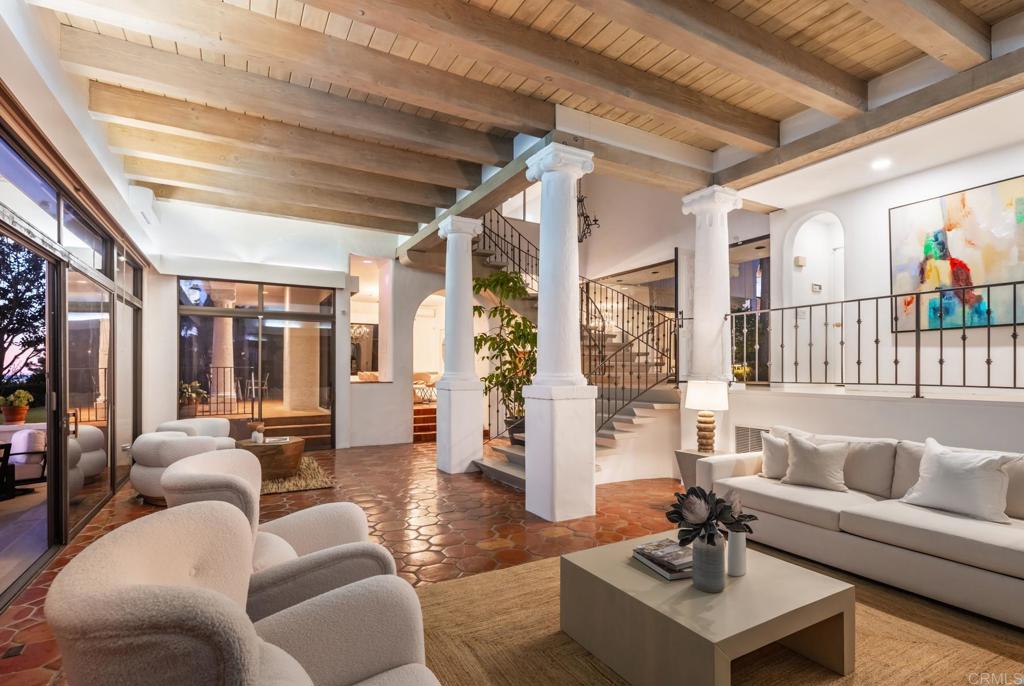 7157 Obelisco Circle Carlsbad, CA 92009 - Photo 20 of 44 a living room with furniture and wooden floor
