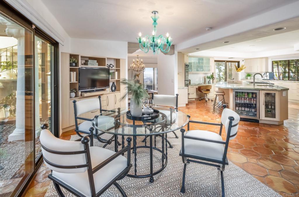 7157 Obelisco Circle Carlsbad, CA 92009 - Photo 28 of 44 a living room with fireplace furniture and a flat screen tv