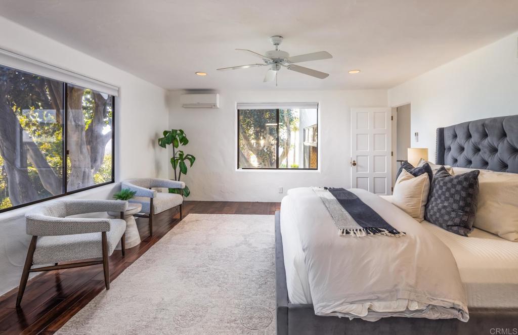7157 Obelisco Circle Carlsbad, CA 92009 - Photo 29 of 44 a bedroom with bed and a couch
