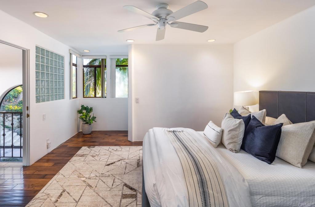 7157 Obelisco Circle Carlsbad, CA 92009 - Photo 39 of 44 a bedroom with a bed and a window