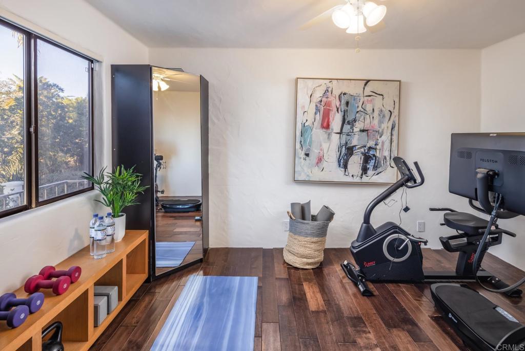 7157 Obelisco Circle Carlsbad, CA 92009 - Photo 40 of 44 a view of a workspace with furniture and wooden floor