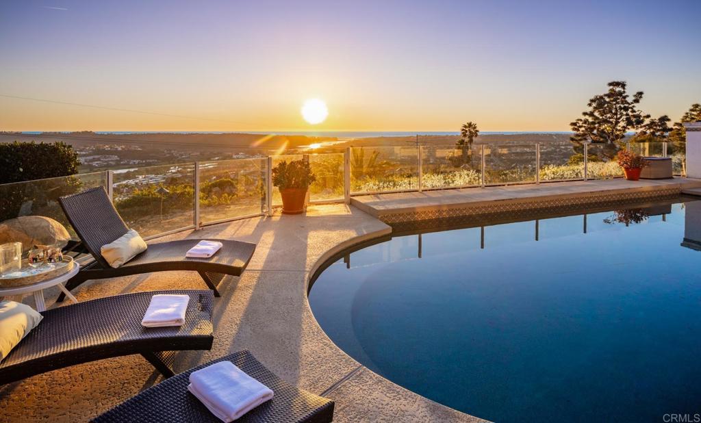 7157 Obelisco Circle Carlsbad, CA 92009 - Photo 4 of 44 a view of a swimming pool with lounge chair