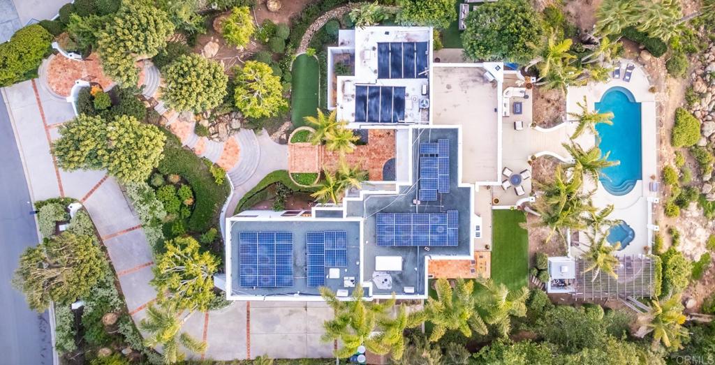 7157 Obelisco Circle Carlsbad, CA 92009 - Photo 44 of 44 a aerial view of a house with a yard and garden in the background