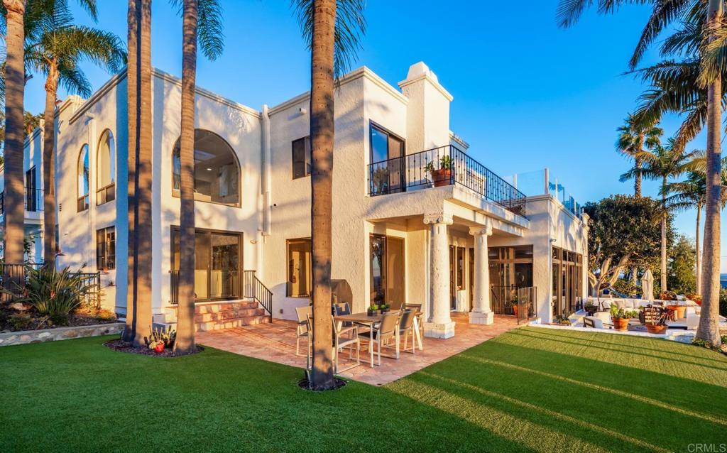 7157 Obelisco Circle Carlsbad, CA 92009 - Photo 6 of 44 a front view of a building with a garden