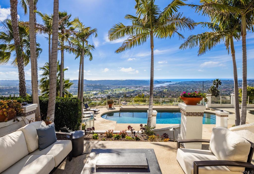 7157 Obelisco Circle Carlsbad, CA 92009 - Photo 9 of 44 a view of a terrace with a sitting space