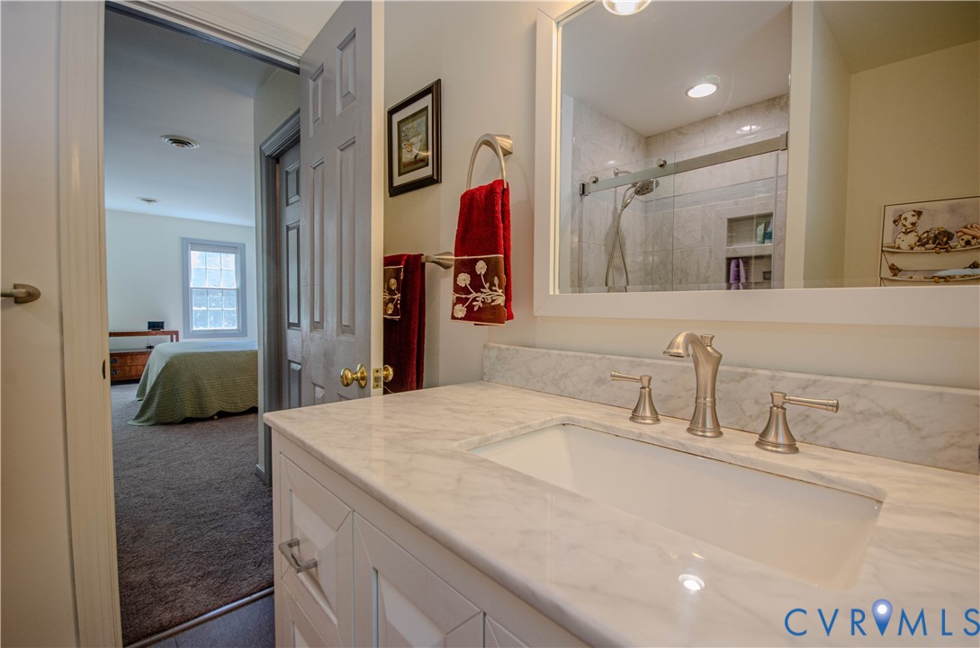 12500 Musical Lane Midlothian, VA 23113 - Photo 25 of 51 Vanity featuring a marble-finish countertop, integ