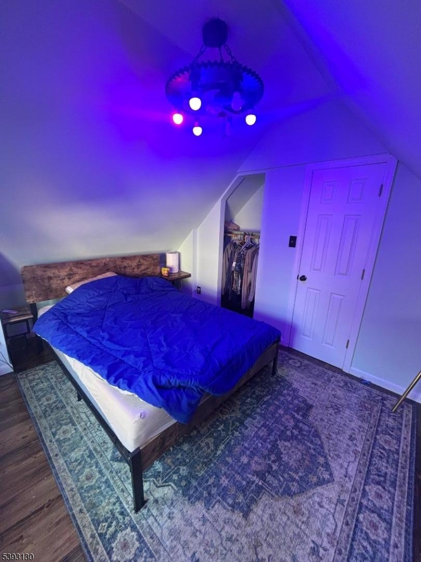 212 4th Street Passaic, NJ 07055 - Photo 11 of 14 a view of a room with a hanging space and a couch