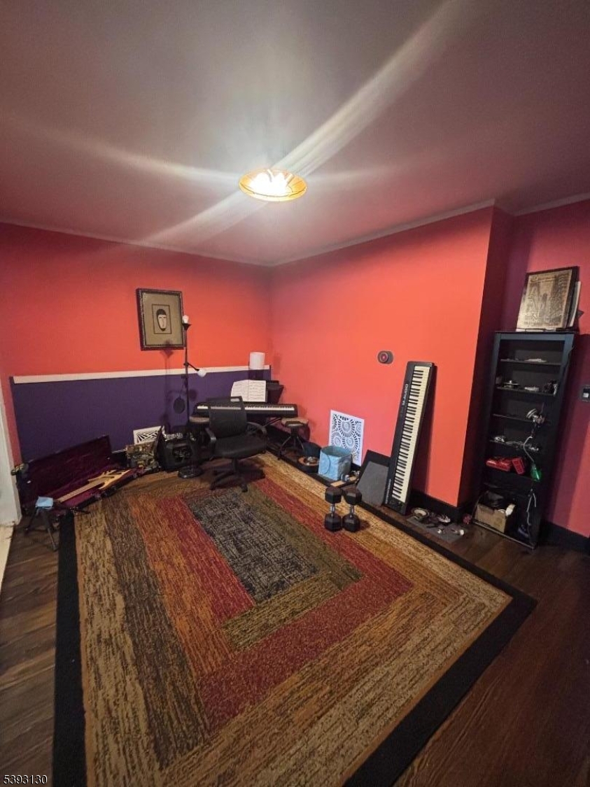 212 4th Street Passaic, NJ 07055 - Photo 5 of 14 a room with gym equipment