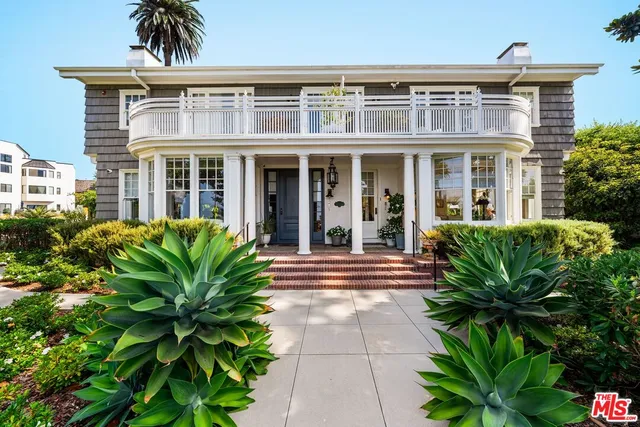 front view of a house with a large window