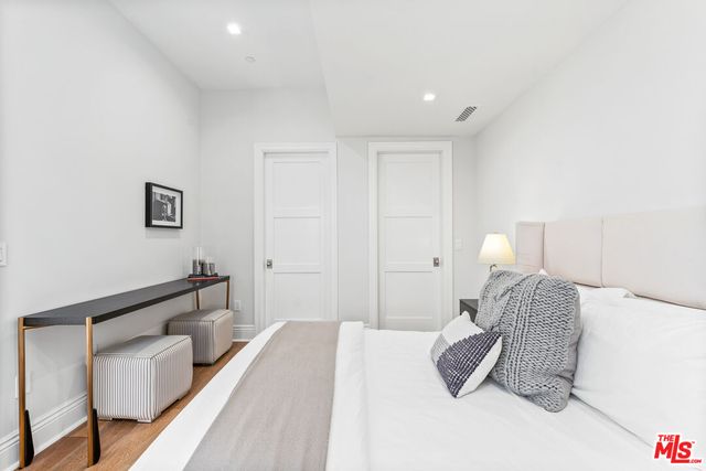 a view of a work space with furniture and wooden floor