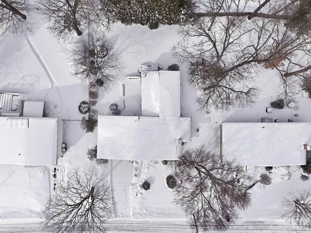with white house with snow in front of it