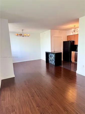 a view of kitchen with furniture and wooden floor