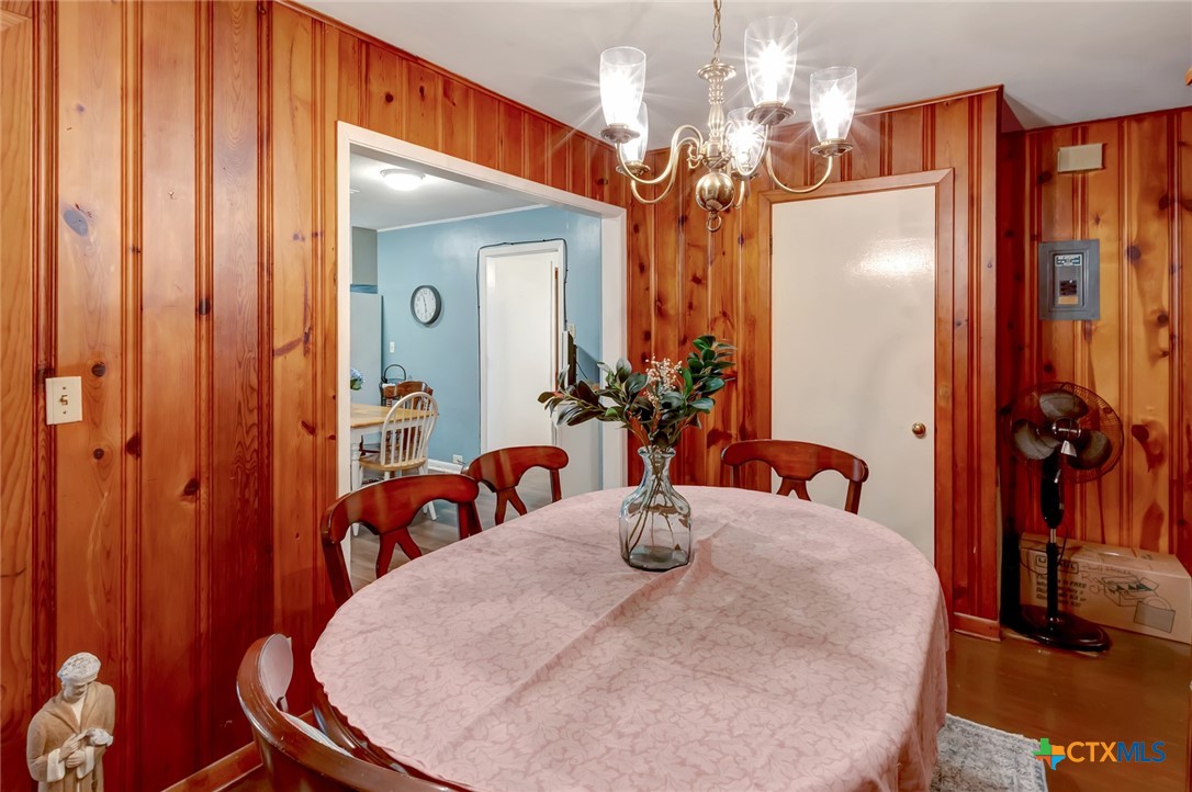 3403 East Rio Grande Street Victoria, TX 77901 - Photo 12 of 41 a view of a dining room with furniture and chandelier