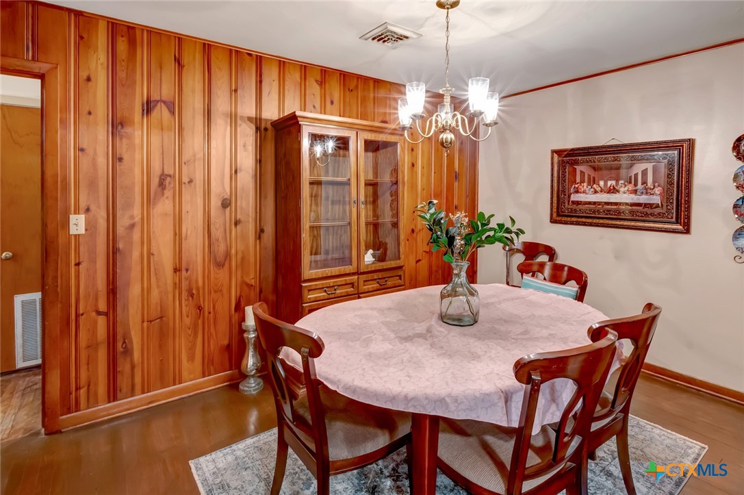 3403 East Rio Grande Street Victoria, TX 77901 - Photo 13 of 41 a dining room with furniture potted plants and wooden floor