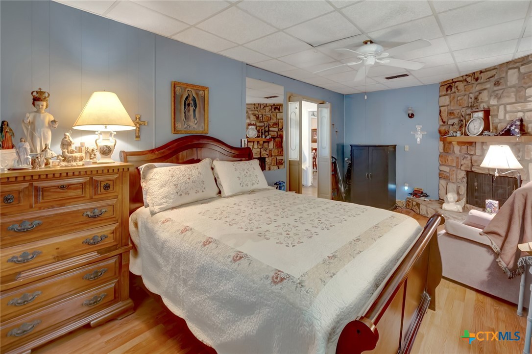3403 East Rio Grande Street Victoria, TX 77901 - Photo 20 of 41 a bedroom with a bed and a lamp on dresser