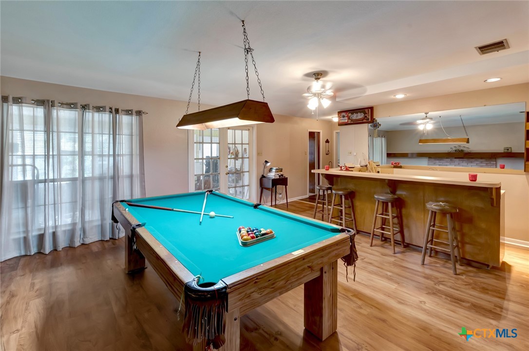 3403 East Rio Grande Street Victoria, TX 77901 - Photo 27 of 41 a room with pool table and windows