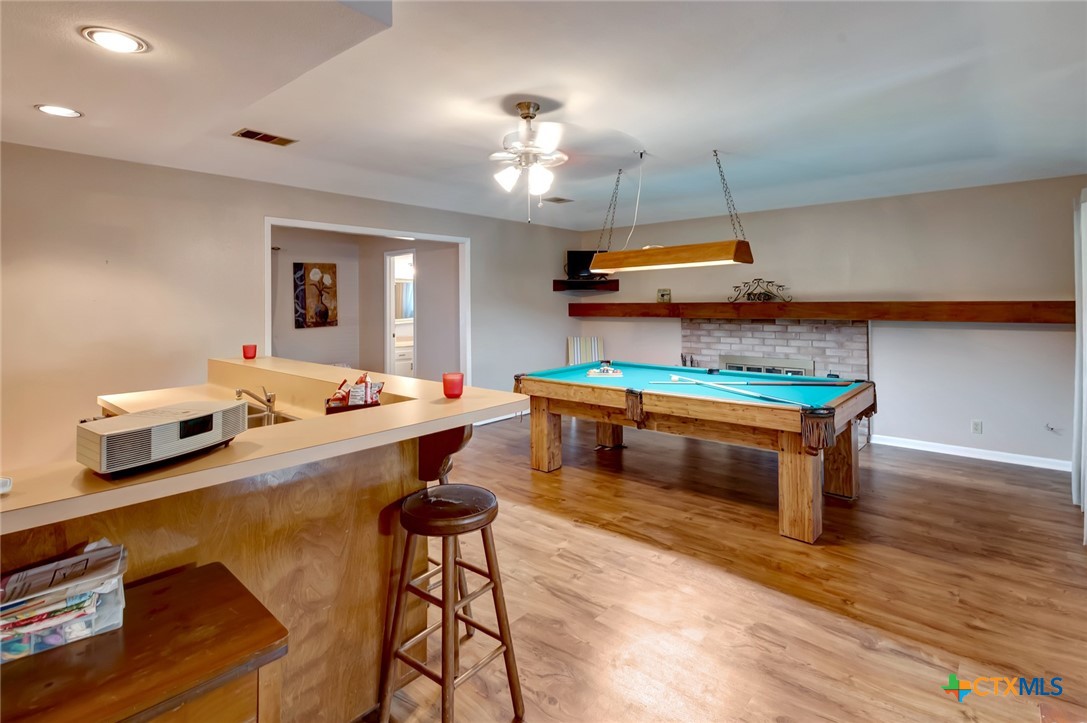 3403 East Rio Grande Street Victoria, TX 77901 - Photo 32 of 41 a living room with furniture and a chandelier