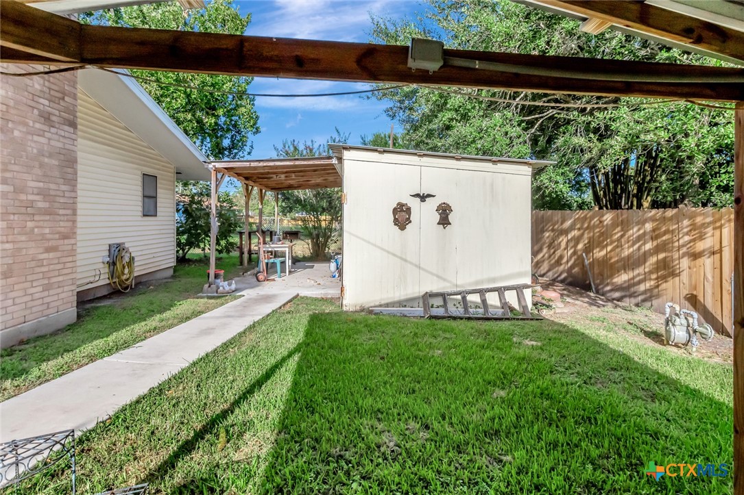 3403 East Rio Grande Street Victoria, TX 77901 - Photo 39 of 41 a view of backyard with a table and chairs and a small yard