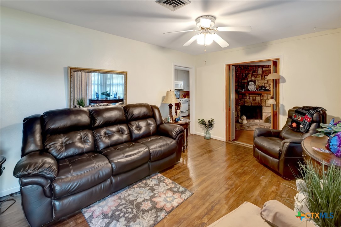 3403 East Rio Grande Street Victoria, TX 77901 - Photo 4 of 41 a living room with furniture and a chandelier