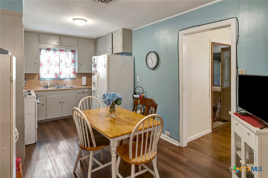 3403 East Rio Grande Street Victoria, TX 77901 - Photo 8 of 41 a view of a dining room with furniture and wooden floor