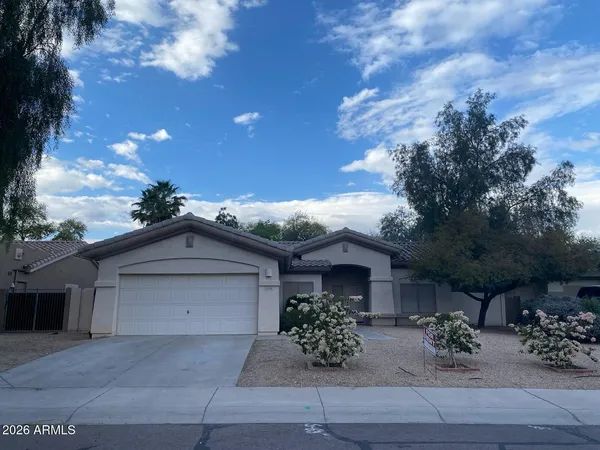 a view of house with yard and entertaining space