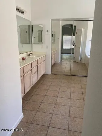 a white bath tub sitting next to a window